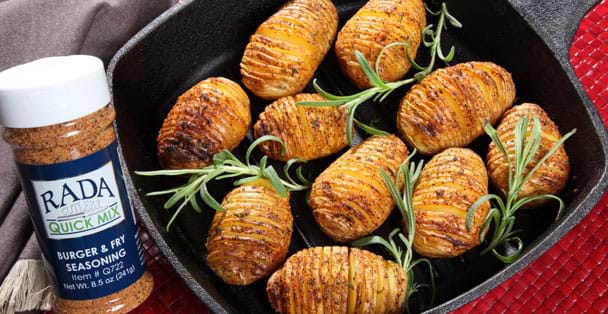 Oven baked hedgehog potatoes in a skillet.