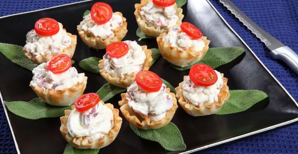 A plate of peachy bacon cheese appetizers with the