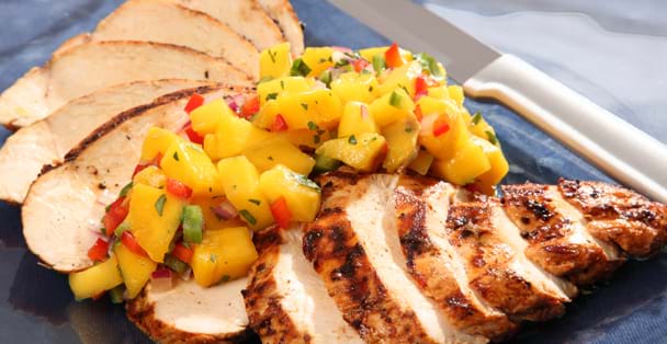 Chicken fillets with fresh mango salsa.