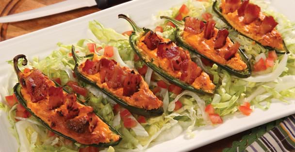 This Baked Jalapenos con Queso recipe packs some h